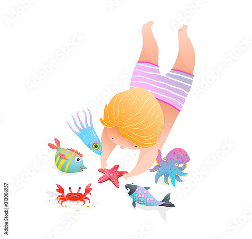 Cute child kid swimming and diving in the ocean with sea creatures.