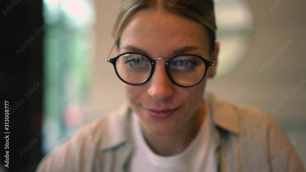 Positive millennial female working remotely with laptop computer doing online transfer with verification debit code, attractive woman booking hotel making prepayment on website