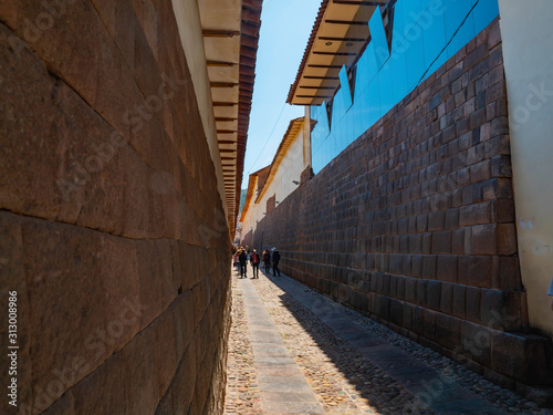Tourists visiting the old part of the city of Cusco. Alleyways and well preserved walls of the ancient imperial inca city, Cusco © videobuzzing