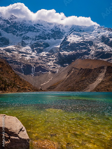 Water with different colors. Blue, green and turquoise on the water of Humantay Lagoon. Salkantay mountain range in the Andes at high altitude, Peru