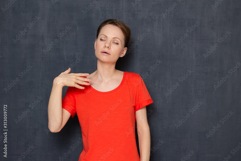 Portrait of overheated sweaty young woman waving hand to cool herself Portrait of overheated sweaty young woman waving hand to cool herself