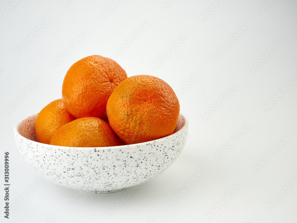 Tangerines or orange Mandarin fruit and peeled slices. A bunch of oranges and half. Tangerines or orange Mandarin fruit and peeled slices. A bunch of oranges and half.