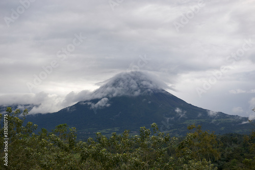 Arenal Volcano With Clouds Blue Sky Sunset