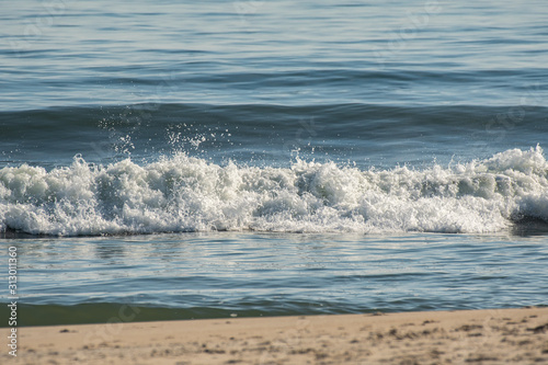 Waves crashing onto the beach from the Atlantic Ocean onto Assateague Island in Ocean City  Maryland