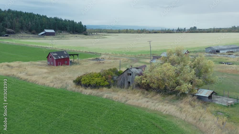 Aerial Of Old Abandoned Western Barns On A Ranch. Big Fork, Montana, USA Aerial Of Old Abandoned Western Barns On A Ranch. Big Fork, Montana, USA