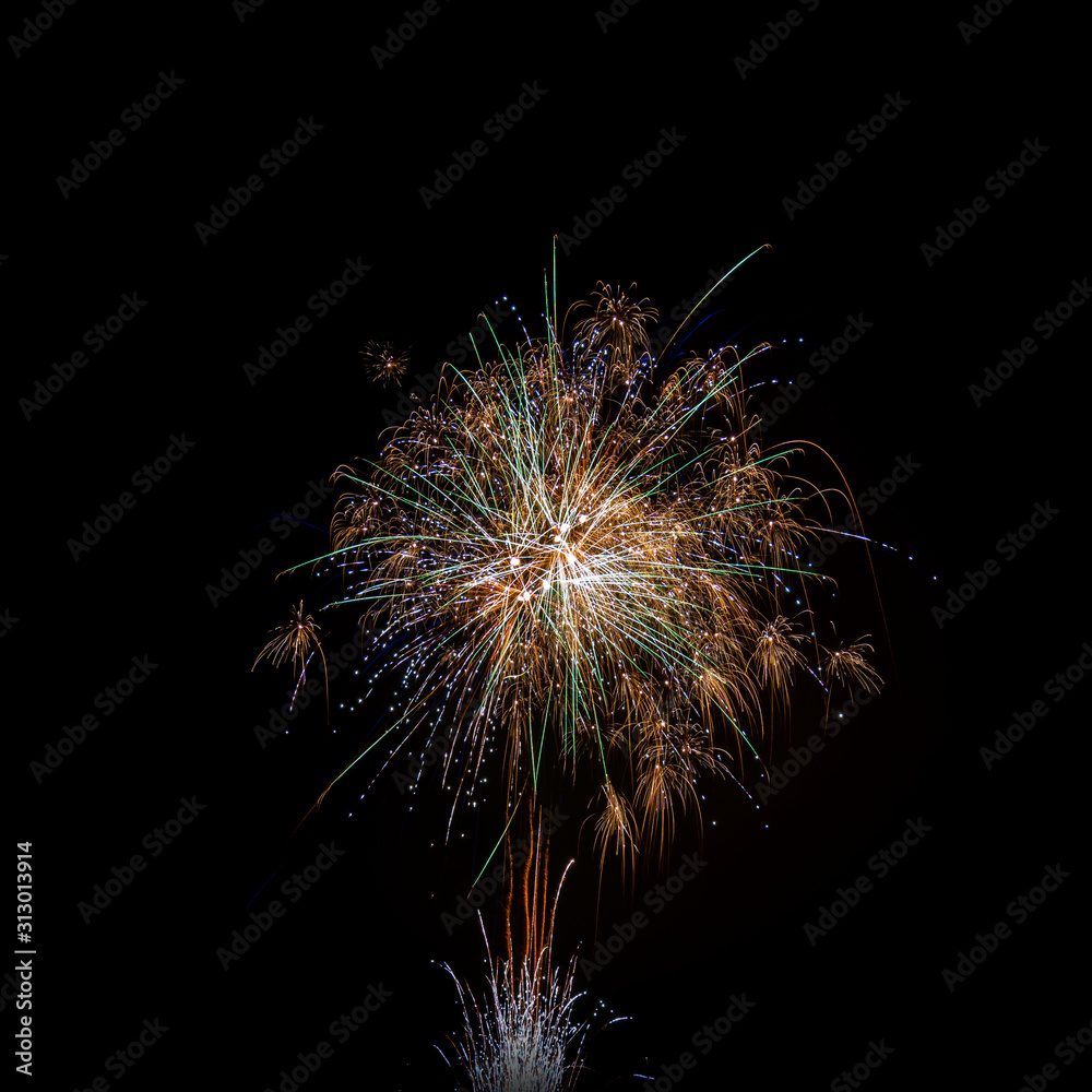 Fototapeta premium isolated multi colored event firework at night