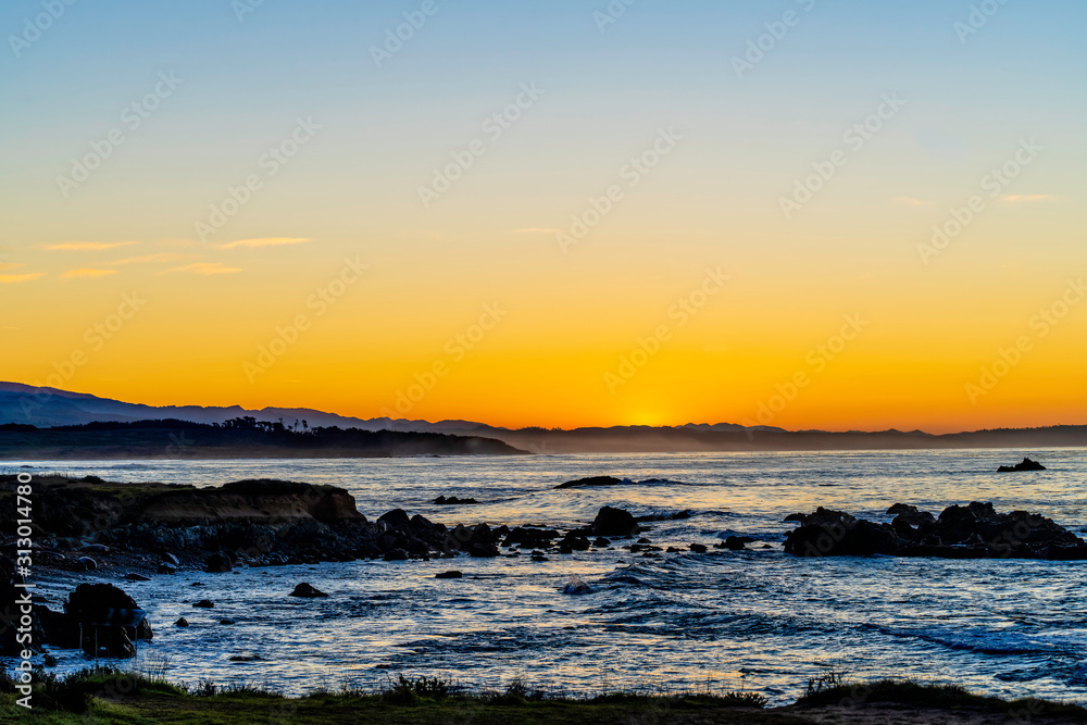 Sunrise over Ocean with Rocks, Shore, Beach 