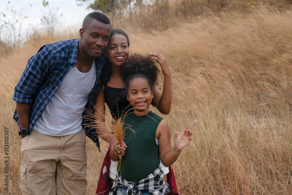 african american family, father, mother and daughter having fun together travel countryside african american family, father, mother and daughter having fun together travel countryside