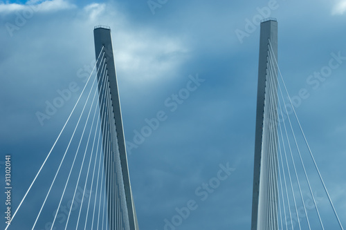 Fototapeta Naklejka Na Ścianę i Meble -  Construction of the Golden bridge against the blue sky.