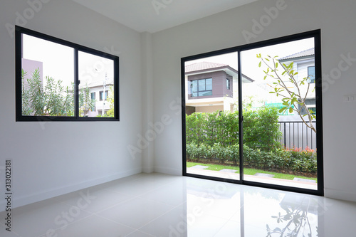 empty white clean room with glass door and window slide in new residential house © sutichak