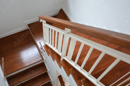 brown wooden stair interior decorated modern style of residential house