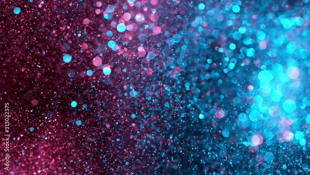 Super slow motion of sparkling abstract glittering background in neon colours. Filmed on very high speed camera, 1000 fps.