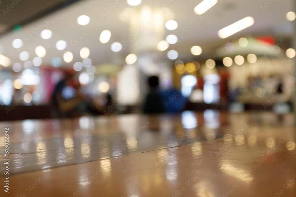 Fototapeta premium wooden table empty of display in cafe with luxury light decoration