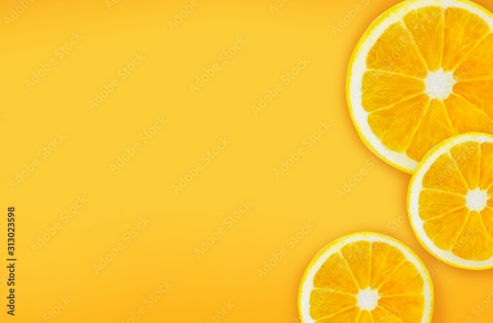 Half cut oranges on orange background. background with space for text writing. Half cut oranges on orange background. background with space for text writing.