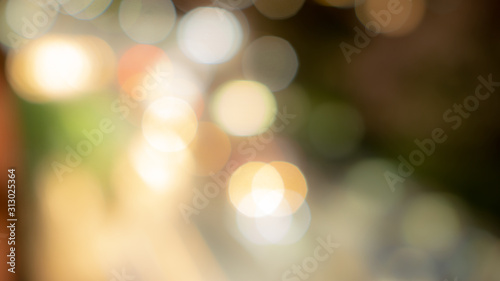 Bokeh image of blurred lighting, circle shape of shiny lights from the city in dark night