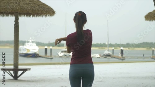 Women Are Stretching Near The Beach  photo