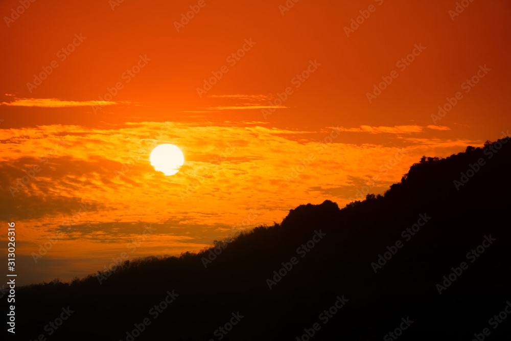 Beautiful sunset with dramatic sky.Tranquility view of sunset with silhouette mountain landscape background. Beautiful sunset with dramatic sky.Tranquility view of sunset with silhouette mountain landscape background.