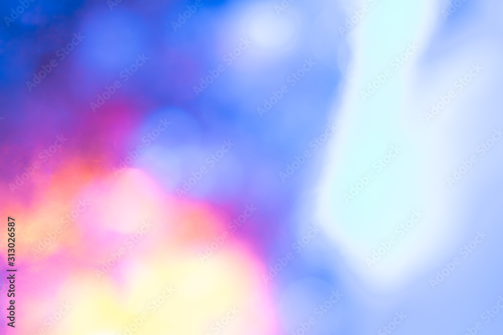 Obraz premium Abstract bright blured colored bokeh. Lights of the night city background.