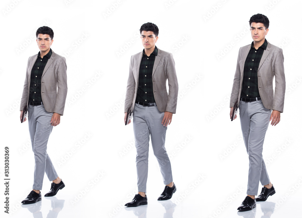 Full Length Snap Figure, Caucasian Business Man walk in Suit dark green shirt gray pants and shoes, He has confident happy smile strong, digital tablet in hand, collage group white background isolated Full Length Snap Figure, Caucasian Business Man walk in Suit dark green shirt gray pants and shoes, He has confident happy smile strong, digital tablet in hand, collage group white background isolated