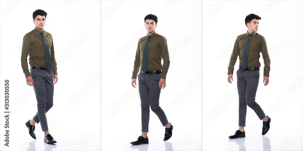 Fototapeta premium Full Length Snap Figure, Young Caucasian Business Man in Suit dark green shirt necktie pants and black shoes, He has confident walk happy smile strong, collage group over white background isolated
