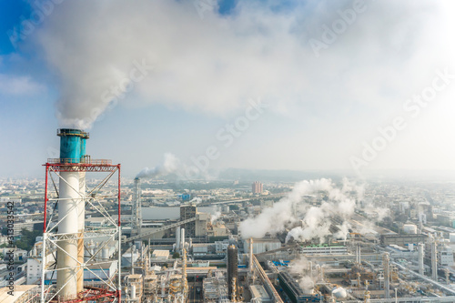 Aerial view of industrial area with chemical plant. Smoking chimney from factory