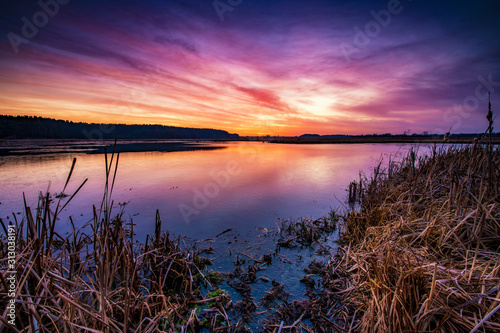 Fototapeta Naklejka Na Ścianę i Meble -  Beautiful sunrise over lake banks