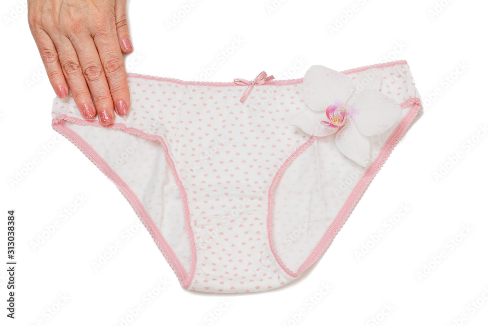 Woman's hand with beautiful panties on white isolated background.