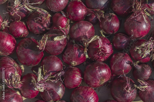 Natural background from red onion close up. Food backgrounds for wallpaper. The concept of proper nutrition and healthy eating. Organic foods and fresh vegetables.