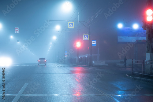 the foogy weather in the city on highway, nobody late in the night © Mihail