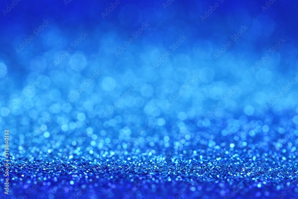 Blue glitter background with light blue shining bokeh.panton 2020 classic blue.classic blue swatch for print, web design Blue glitter background with light blue shining bokeh.panton 2020 classic blue.classic blue swatch for print, web design