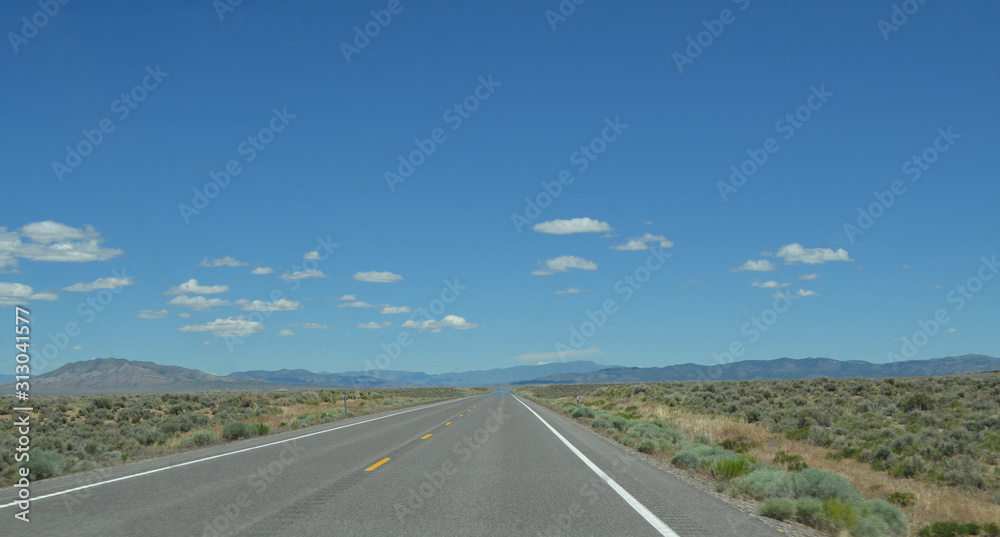 Late Spring in Nevada: Expansive Landscape and Sky near Eureka on Hwy 50 - The Loneliest Highway in America Late Spring in Nevada: Expansive Landscape and Sky near Eureka on Hwy 50 - The Loneliest Highway in America