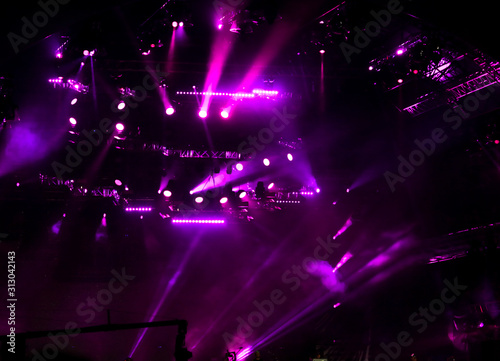 Purple light on a rock concert stage as background © schankz