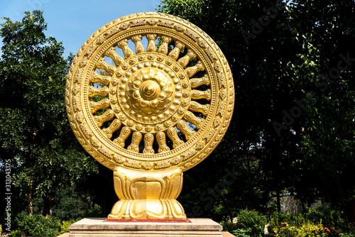 Canvas Print close up Golden Wheel of Dhamma or Wheel of life and symbol teaching of the Lord