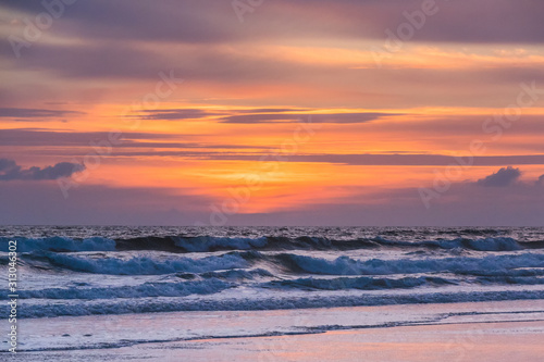 Crashing waves at the back at sunrise