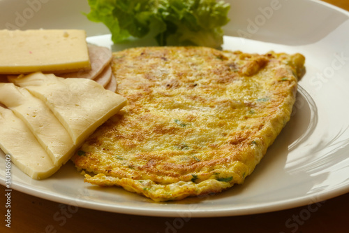 Omelet with cheese and salad