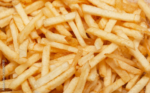 thin straw fried potatoes on a white background