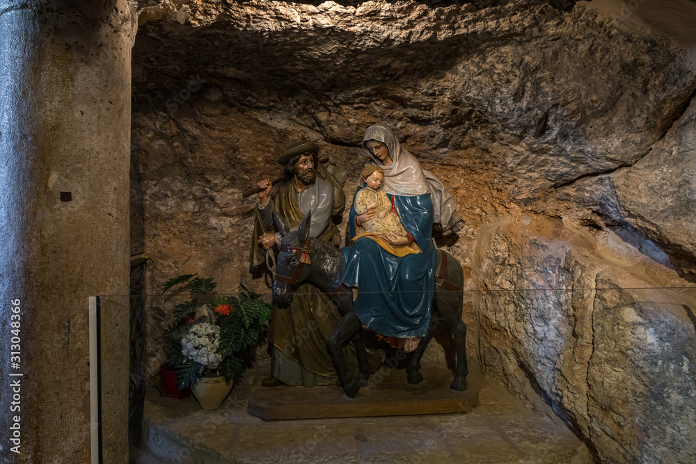 Figures depicting a scene from the Bible stand in a niche in the Milk Grotto Church in Bethlehem in Palestine