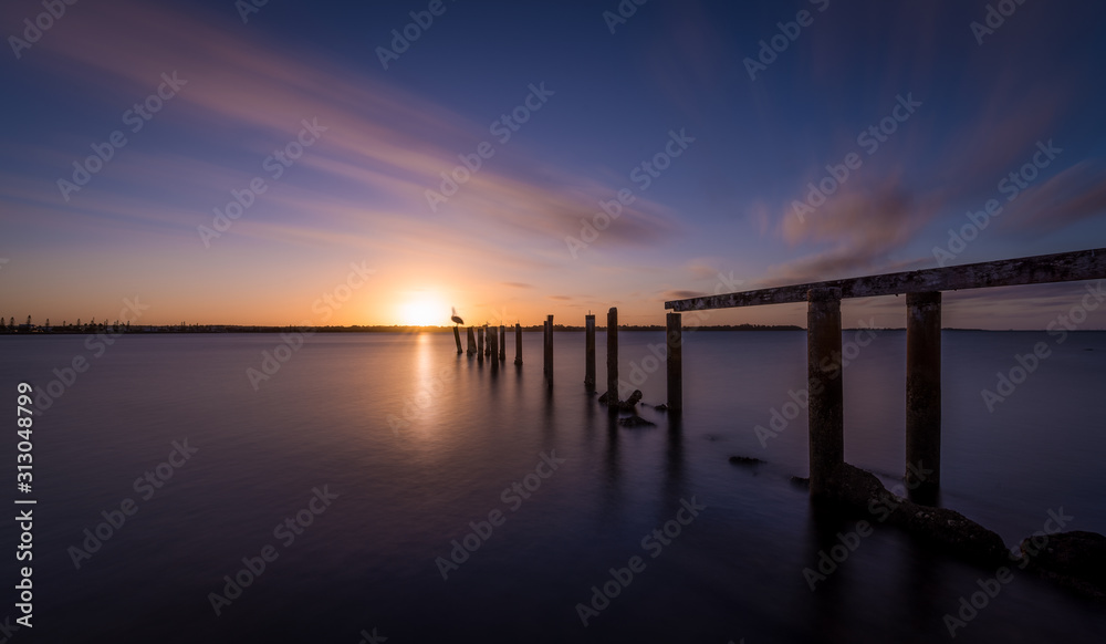 wooden pier at sunset