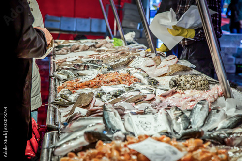Venetian fish market. The Rialto fish market is located alongside the Grand Canal near the Rialto Bridge - Venice, Italy