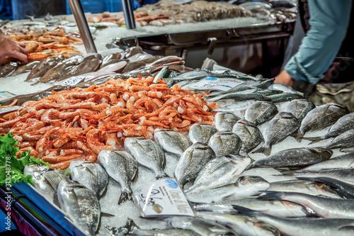 Venetian fish market. The Rialto fish market is located alongside the Grand Canal near the Rialto Bridge - Venice, Italy