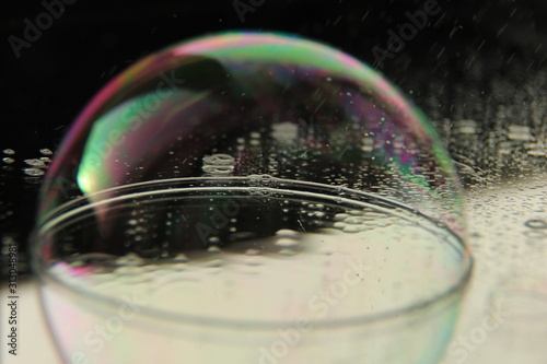 soap bubble on the mirrored surface.