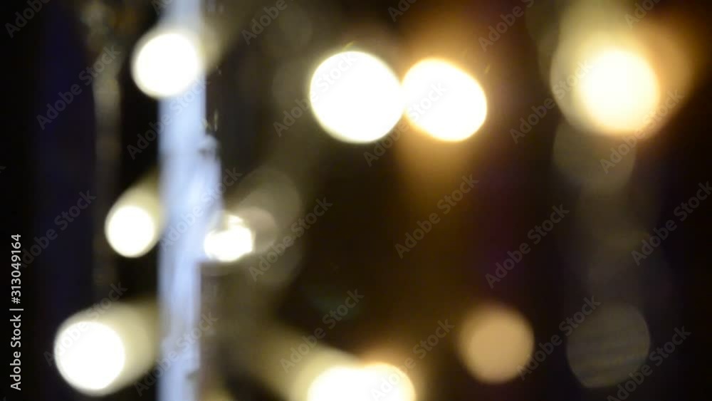 Abstract blurry out of focus blinking multicolored lights Christmas garlands Abstract blurry out of focus blinking multicolored lights Christmas garlands