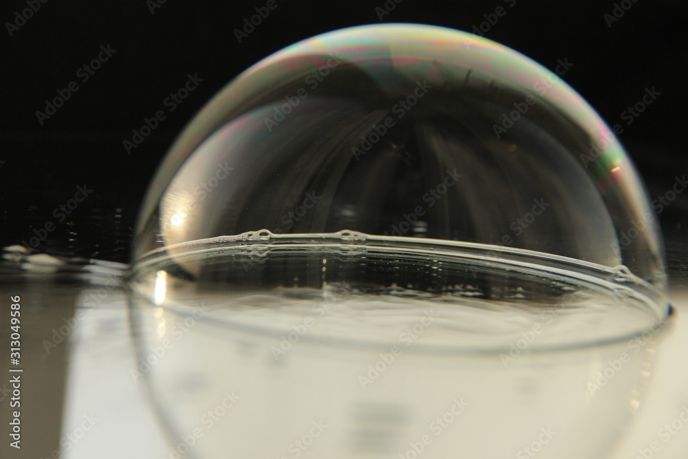 soap bubble on the mirrored surface.