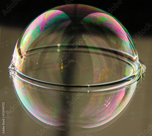 soap bubble on the mirrored surface.
