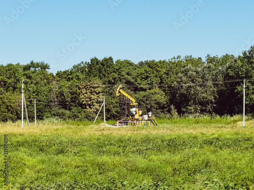 Pumping unit as the oil pump installed on a well photo