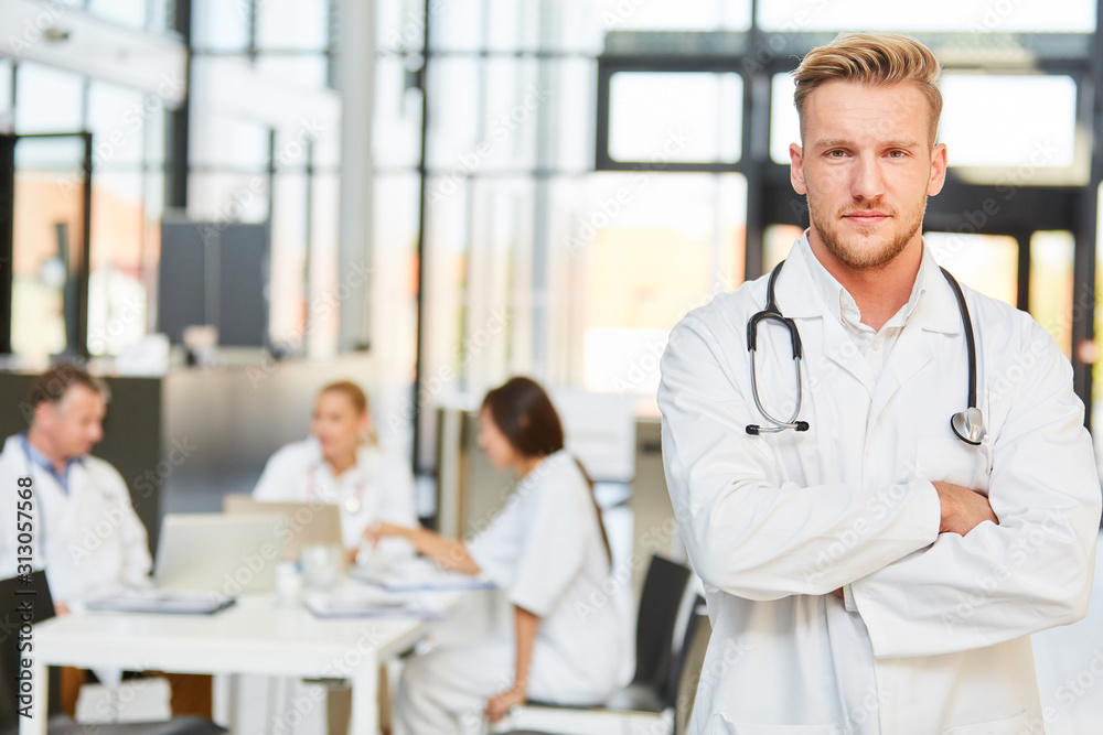 Young man as a doctor with crossed arms Young man as a doctor with crossed arms