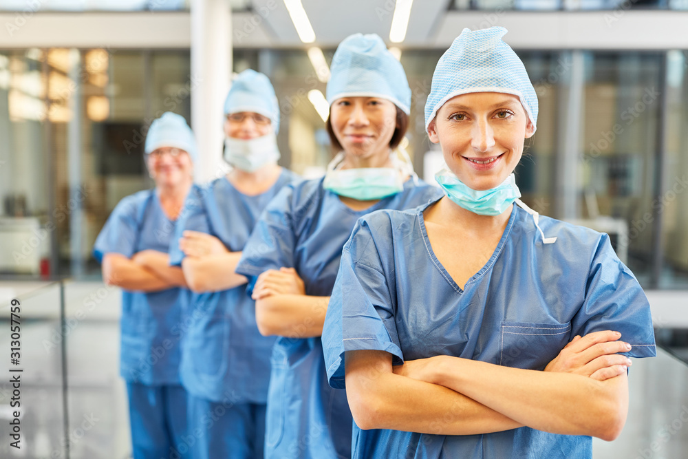 Group of surgeons as a confident medical team Group of surgeons as a confident medical team