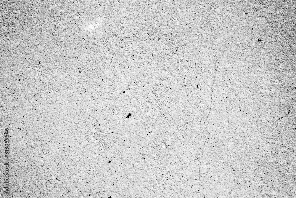 Texture of a concrete wall with cracks and scratches which can be used as a background Texture of a concrete wall with cracks and scratches which can be used as a background