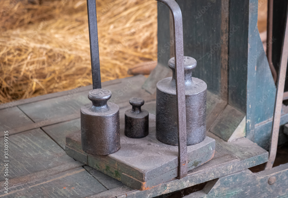 Vintage iron weights on vintage scale