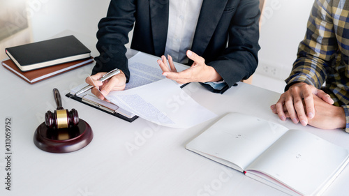 lawyer having meeting and consoling solution to his clients provide legal advice and trust commitment strain serious for problem, justice and attorney concept.